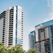 a couple of tall buildings sitting next to each other