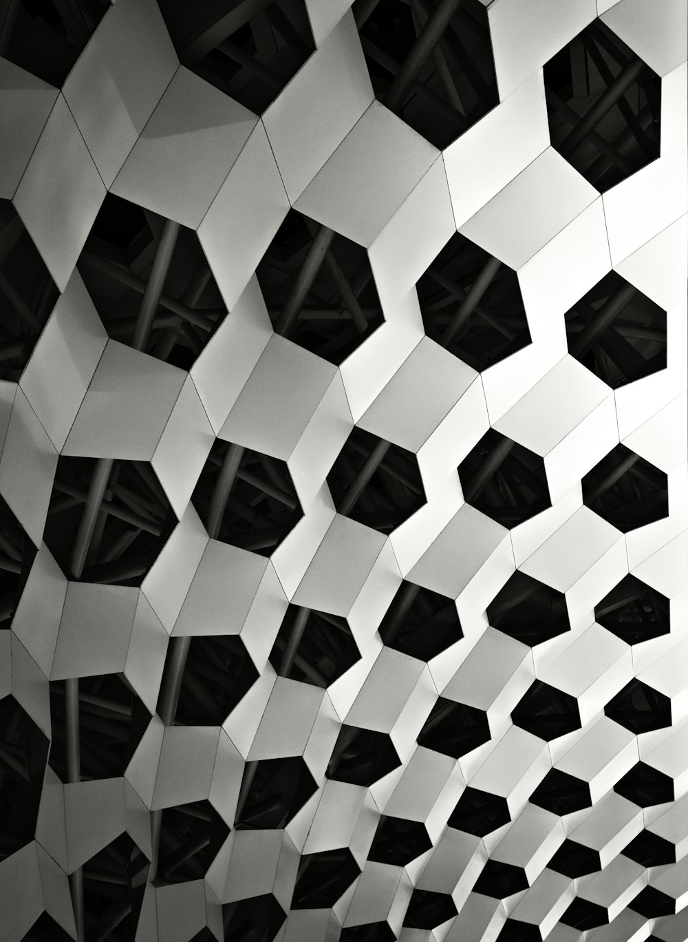 a black and white photo of a geometric structure