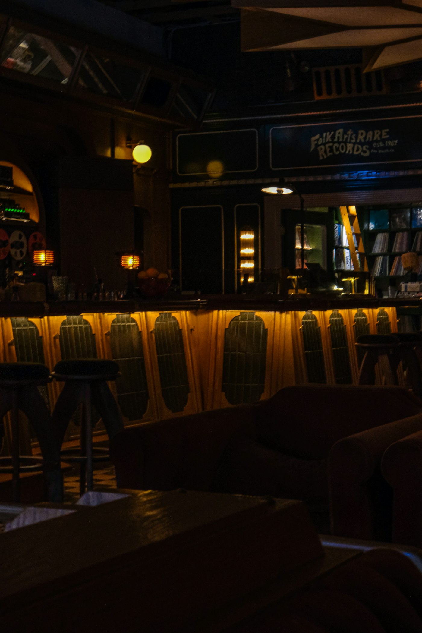 Low-lit booths along the wall