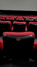 Dynamic cinema seats moving with rain and wind effects during a 7D movie screening.