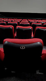 Dynamic cinema seats moving with rain and wind effects during a 7D movie screening.