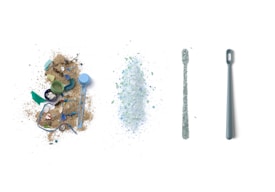 A composition of four aligned elements on a white background. From left to right: a pile of beach debris including sand, small plastic items and bottle caps; a mound of finely shredded plastic pieces; a narrow strip of shredded plastic; and a grey plastic dental tool.
