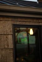 The bakery storefront with a welcoming sign and morning light streaming in.