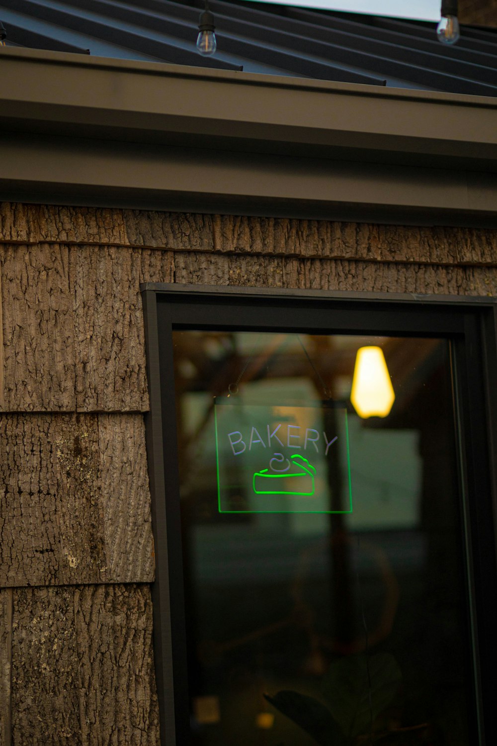 a window with a sign that says bakery on it