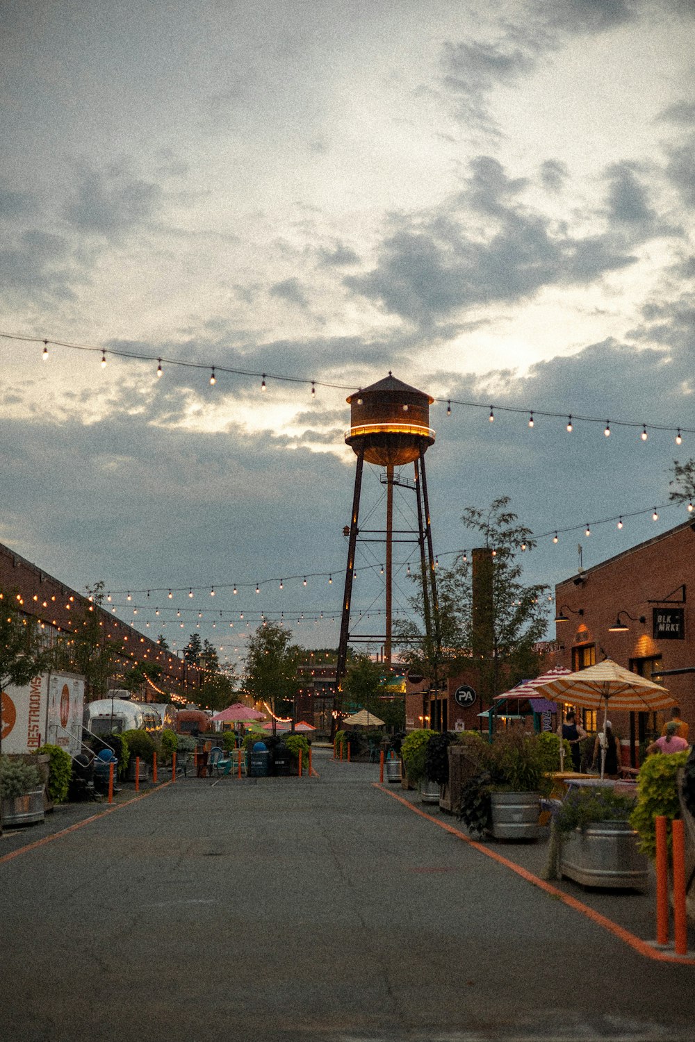 a street with a water tower in the background