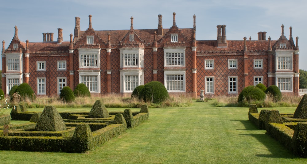 a large building with a lawn in front of it