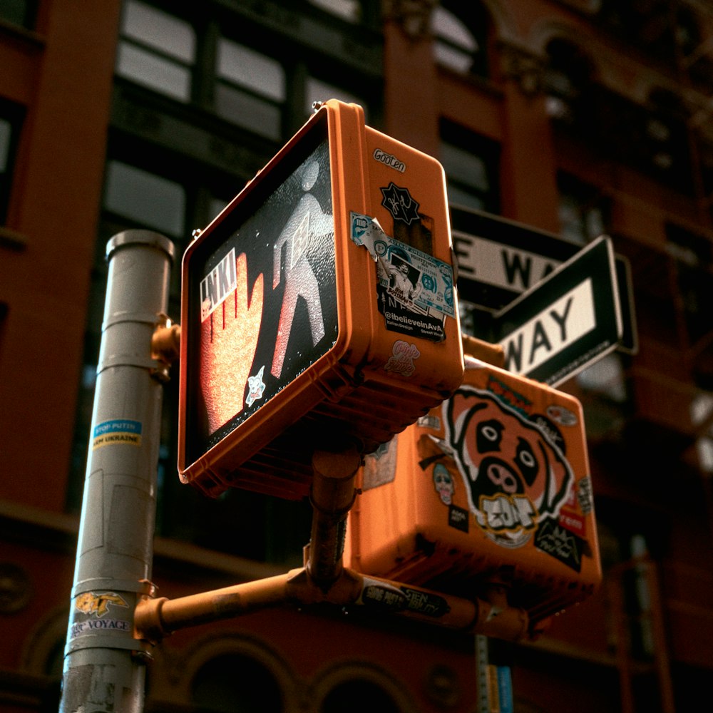 a close up of a street sign with a building in the background