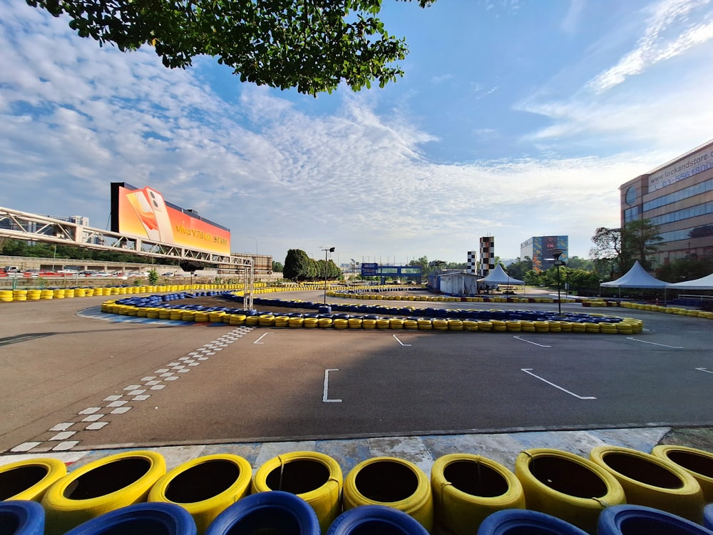a parking lot with a lot of yellow and blue tires