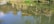 A happy customer standing beside a pond filled with fish.