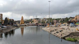 a body of water surrounded by a city