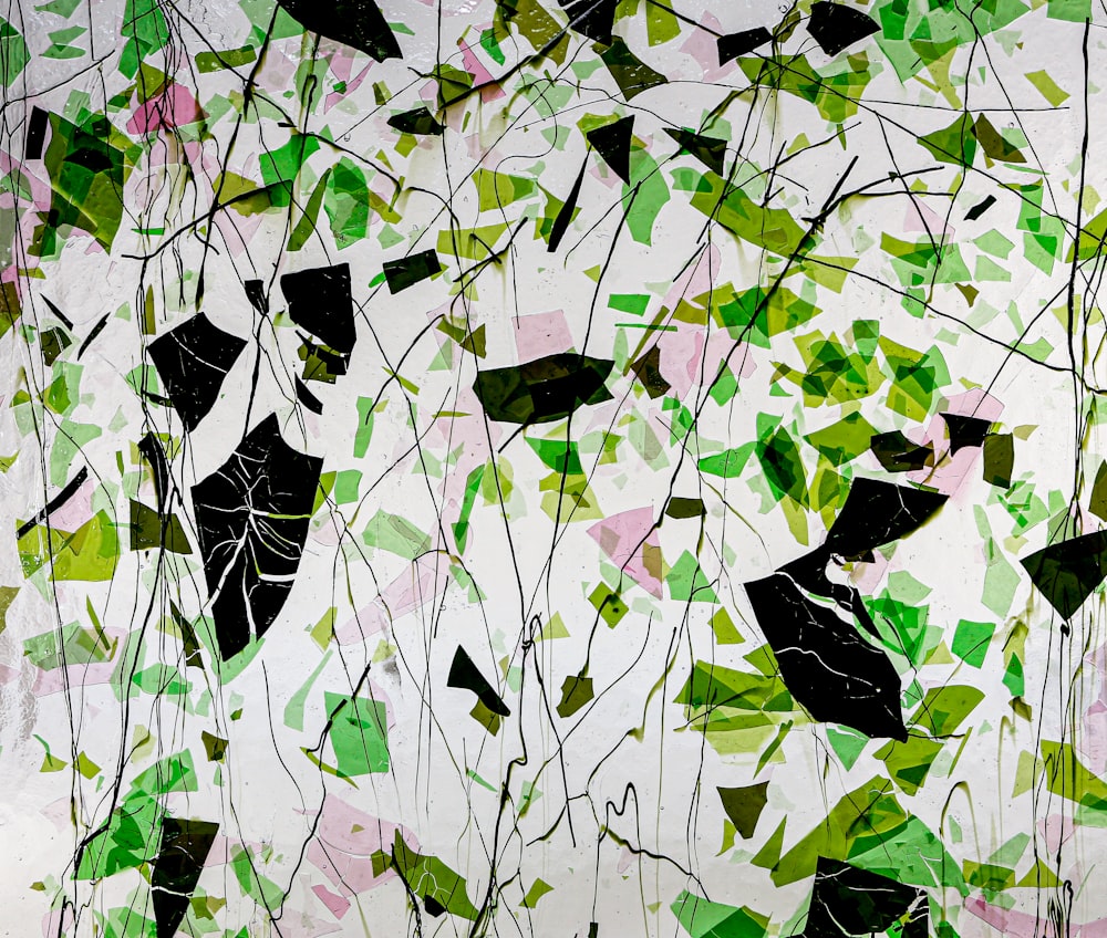 a painting of green leaves on a white background