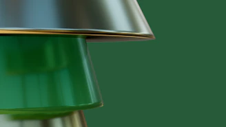 a close up of a green lamp on a green background
