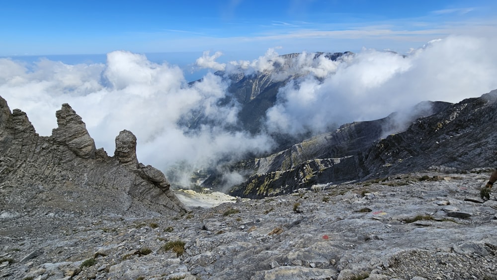 a man standing on top of a rocky mountain