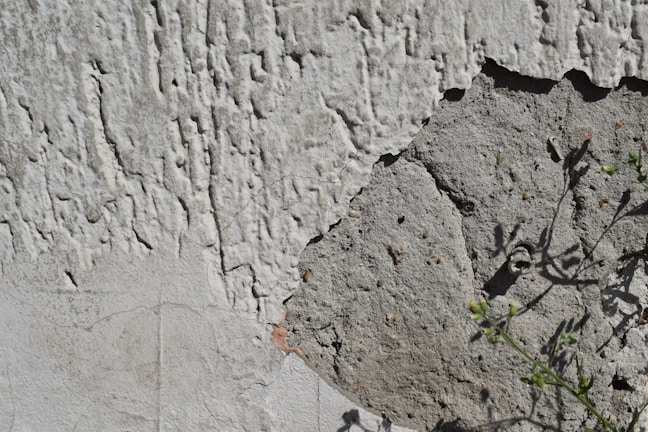 Close-up of freshly applied stucco on a home's exterior wall.