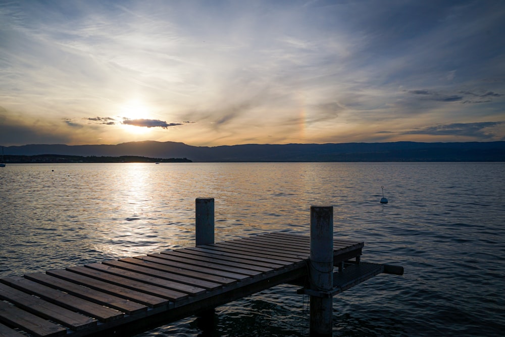 a wooden dock sitting on top of a body of water