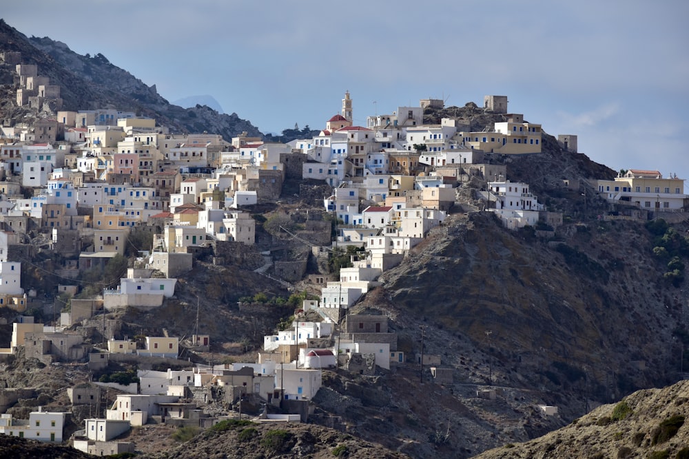 a city on a hill with a church on top of it