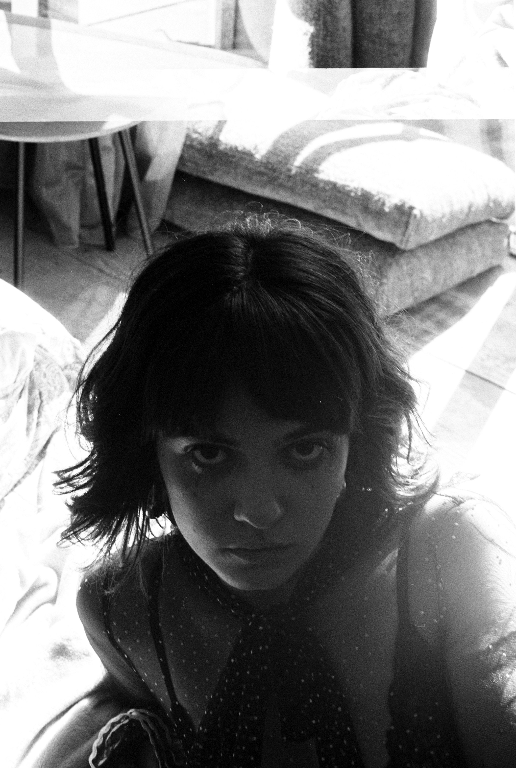 a gender neutral person with a choppy haircut