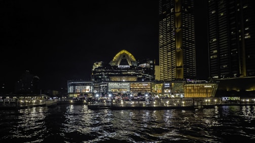 a large body of water next to a city at night