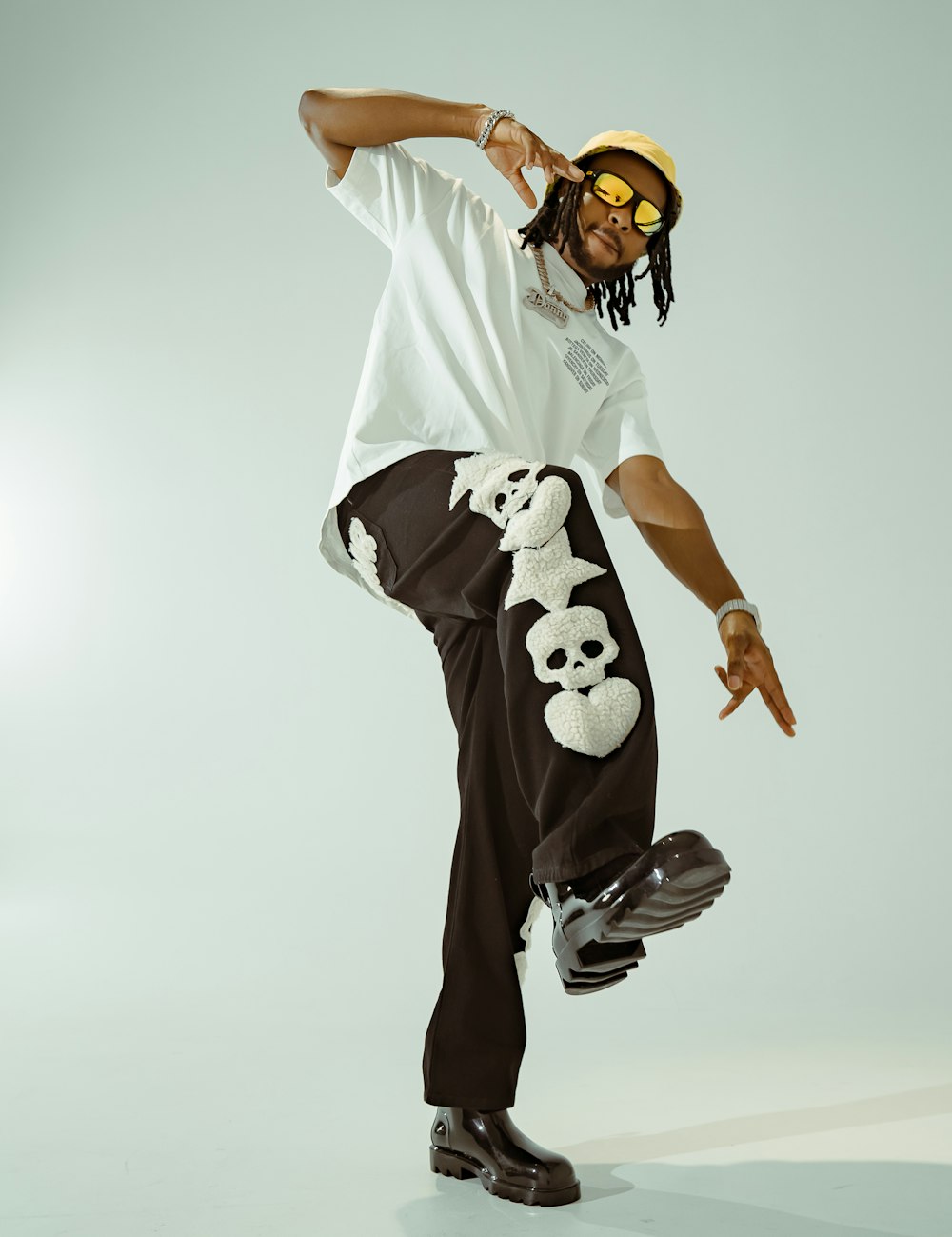 a man in white shirt doing a trick on a skateboard