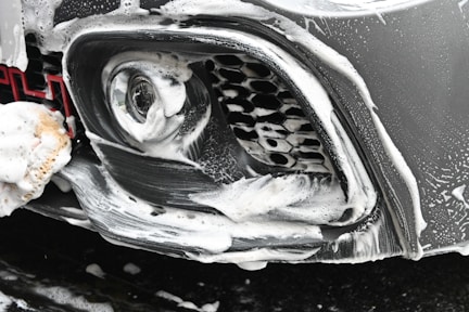 a close up of a car with snow on it