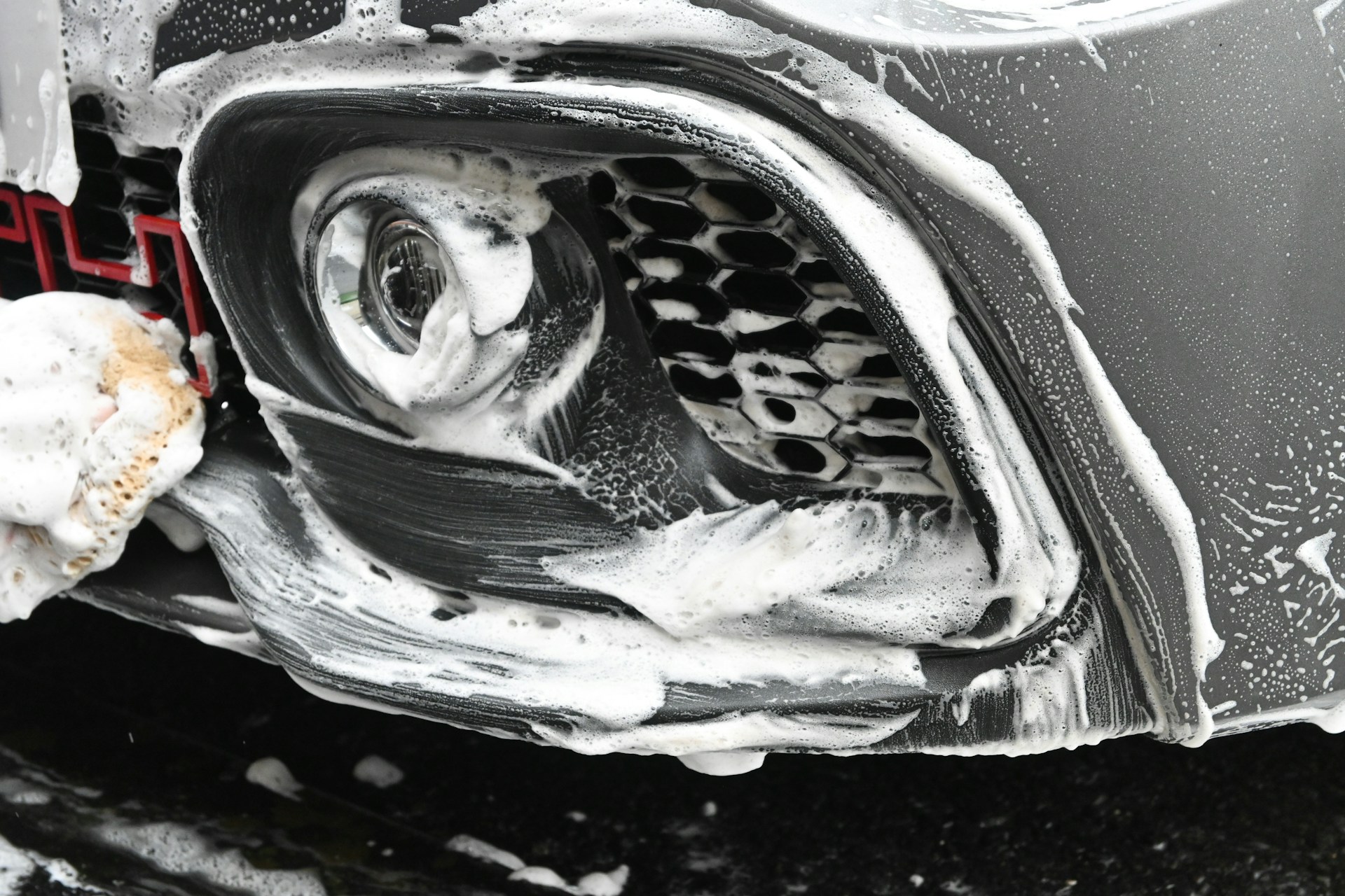 a close up of a car with snow on it