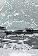 Before and after images of a windshield repair process.