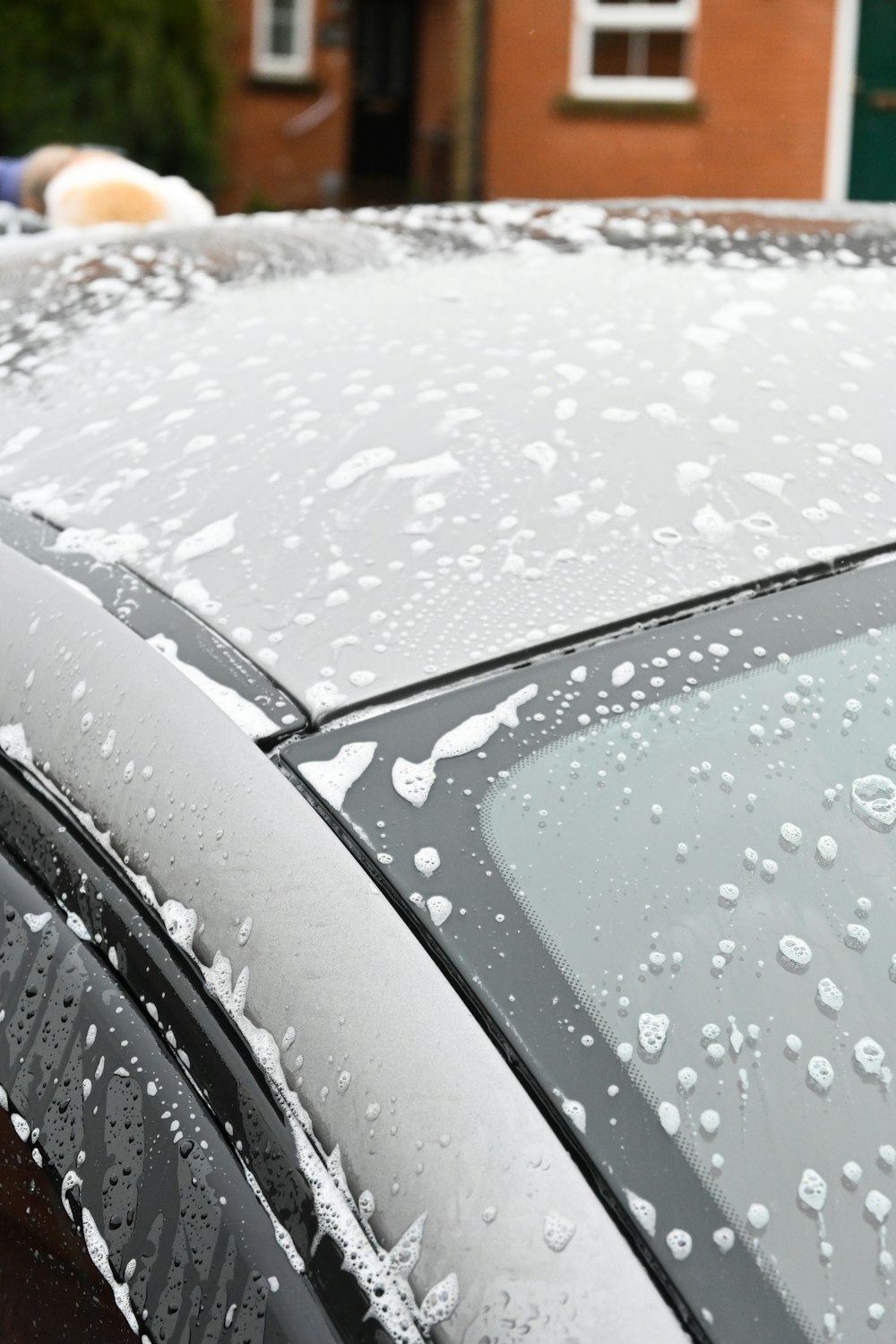 a close up of a car covered in rain