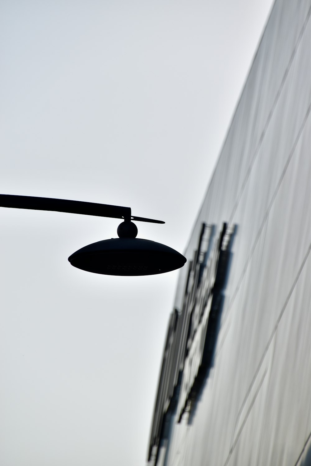 a street light hanging from the side of a building