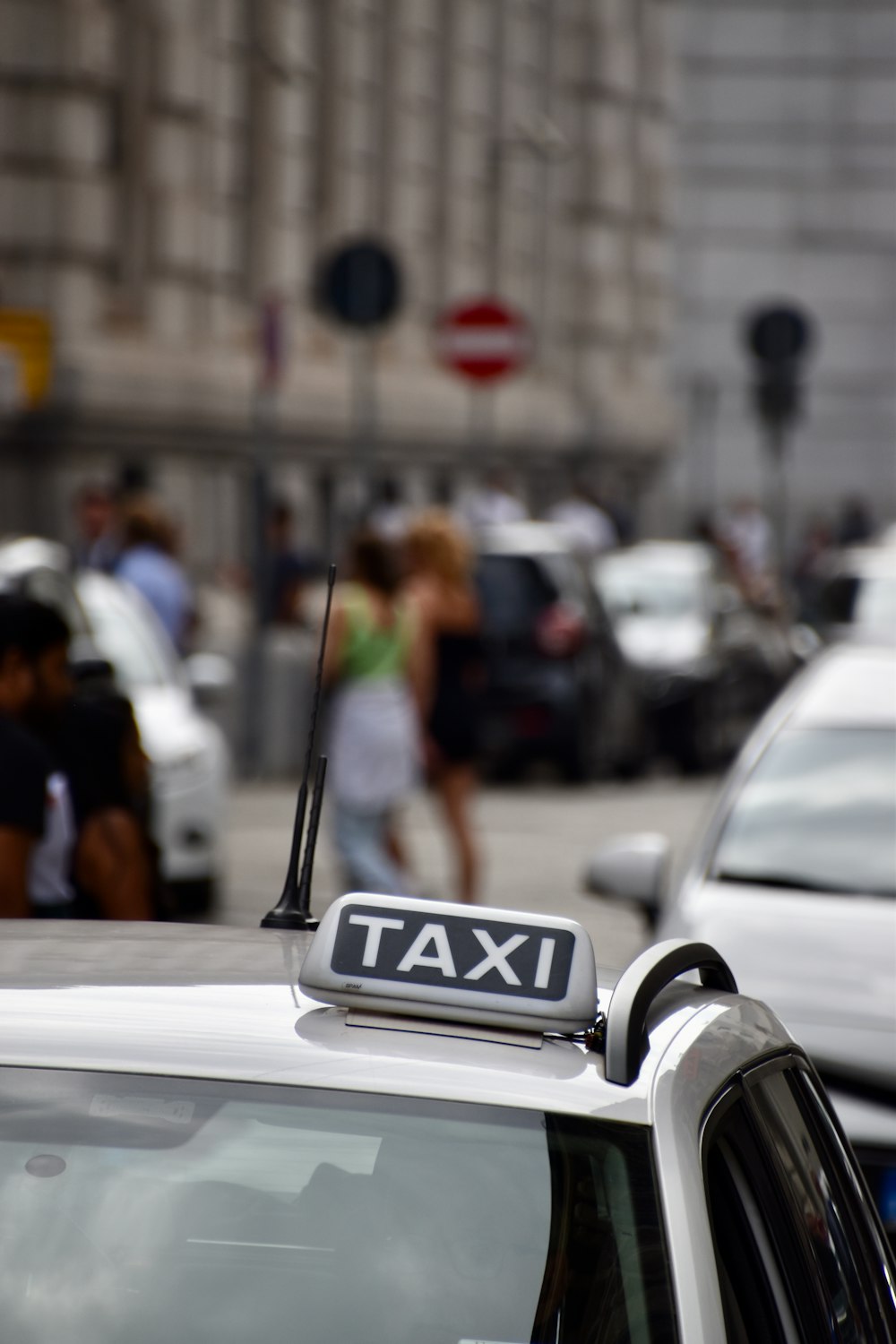 a taxi cab with a taxi sign on top of it