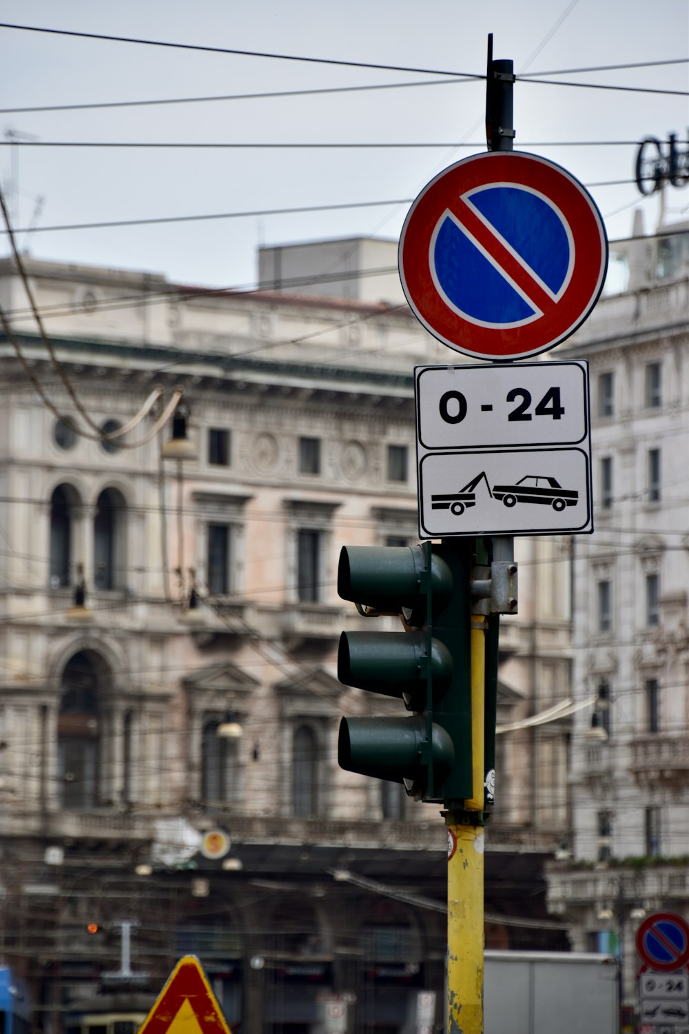 a traffic light with a no parking sign on it