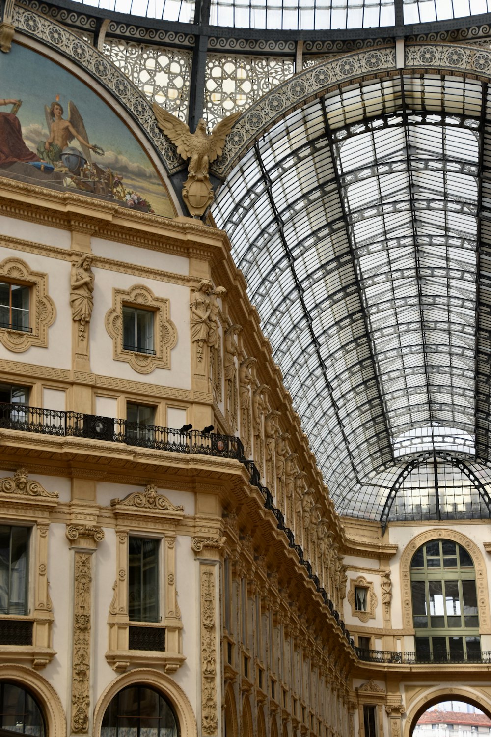 a large building with a glass ceiling and a clock