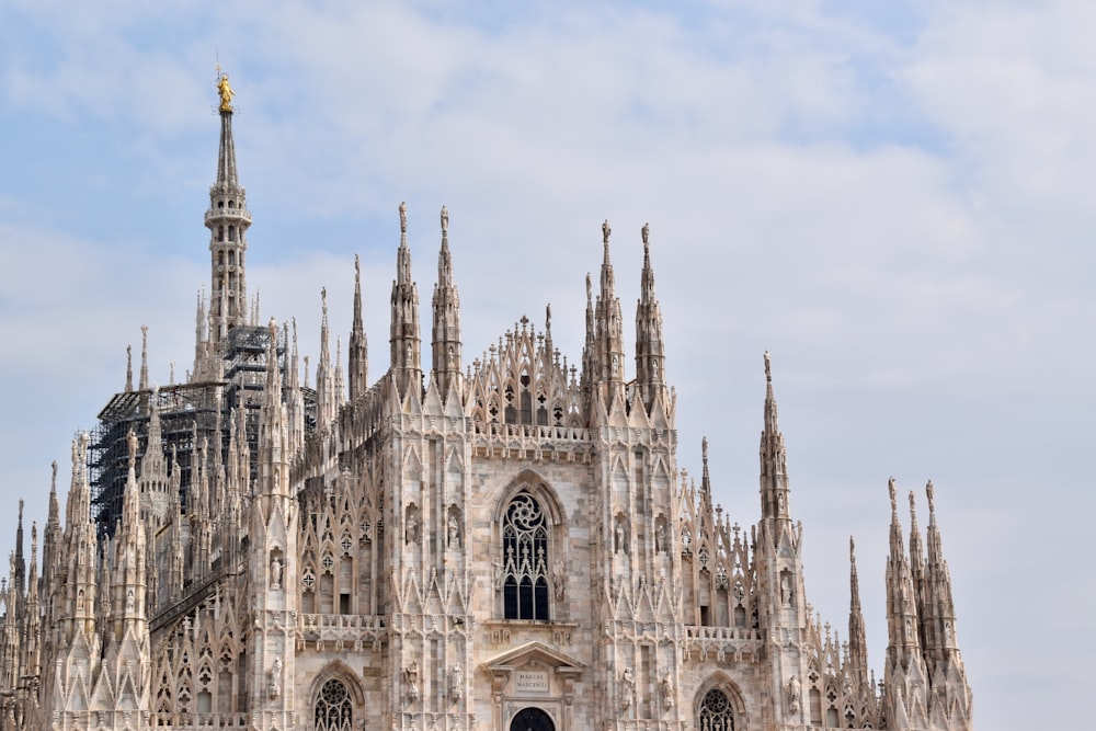 a large cathedral with a clock on the front of it