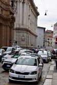 a city street filled with lots of parked cars