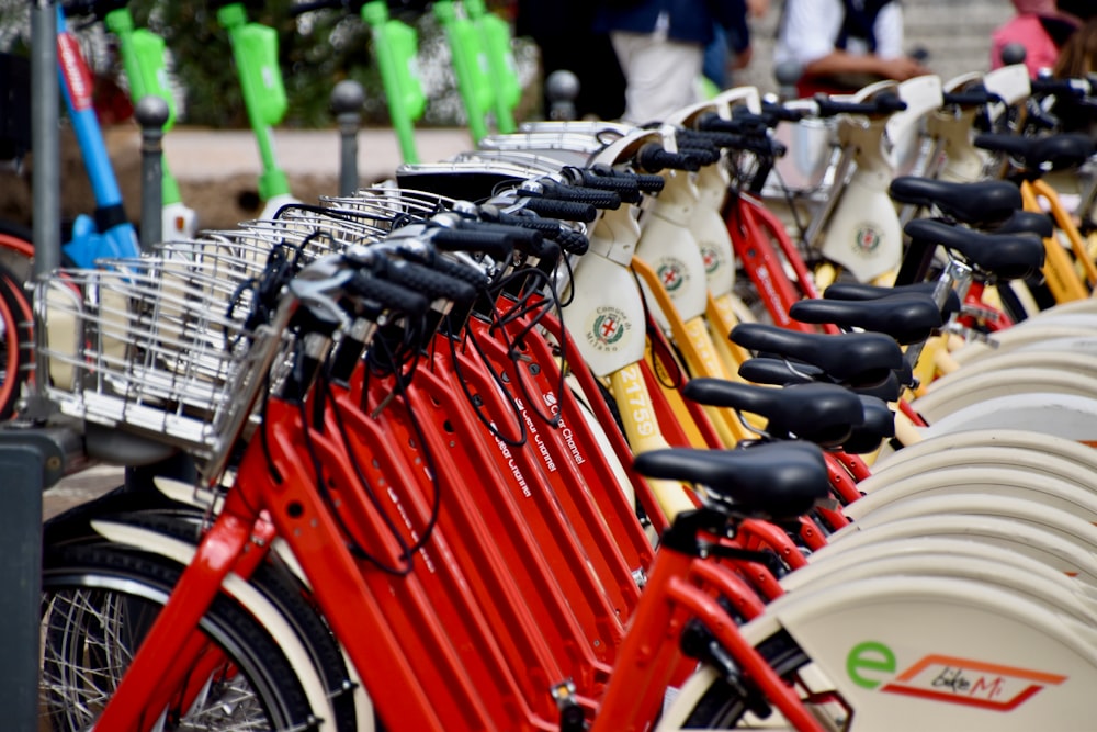 a row of red bikes parked next to each other