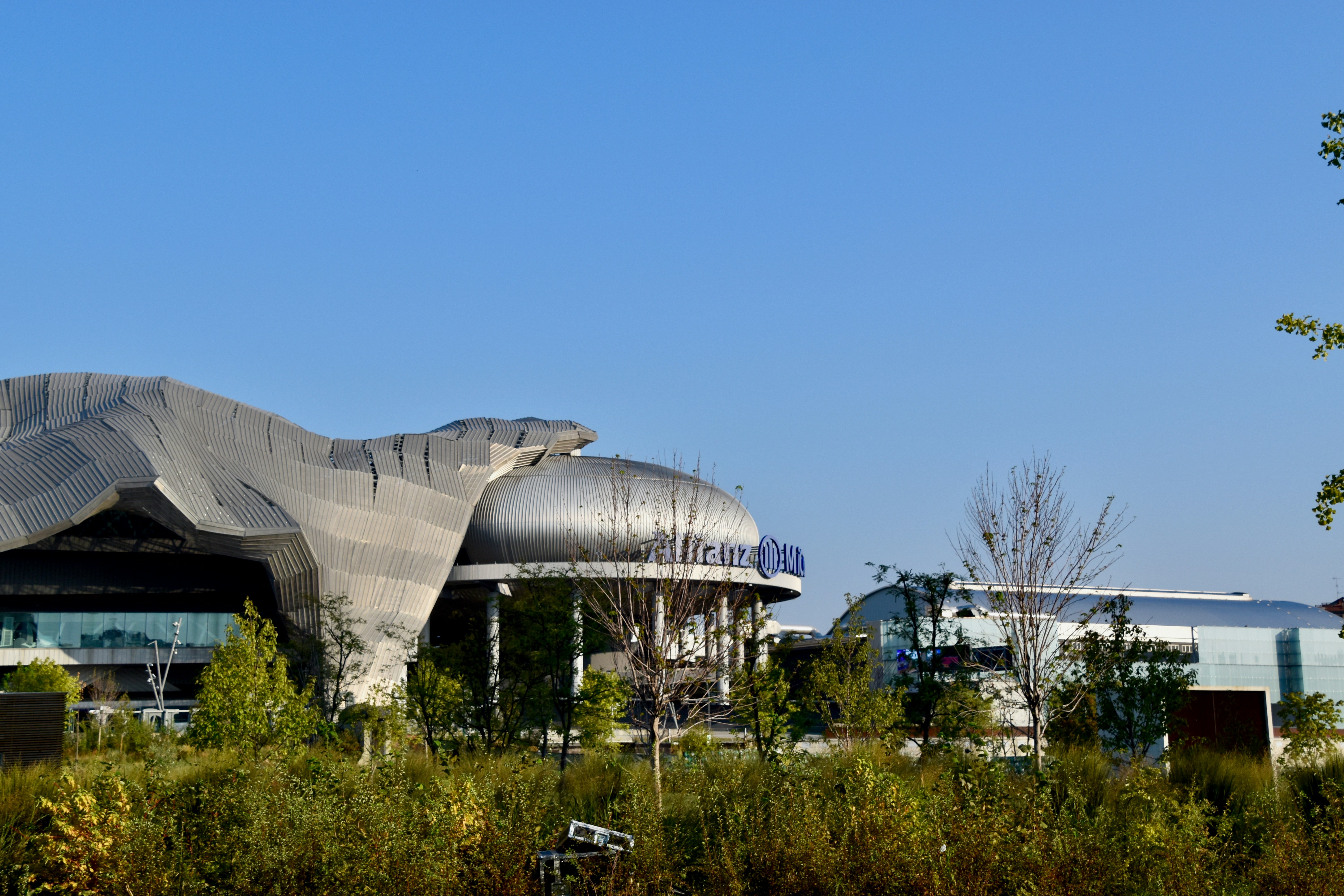 a large building with a giant metal object on top of it
