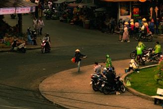 A vibrant market scene in Hanoi with colorful stalls and locals bustling about their day.