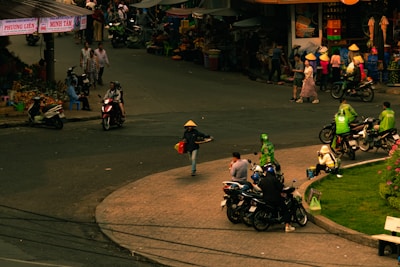 A vibrant street market scene in Vietnam bustling with colorful produce and smiling locals.
