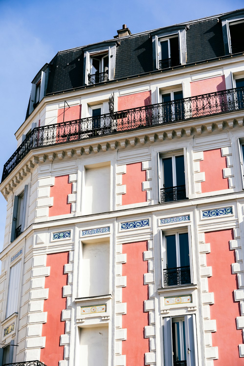 a tall building with balconies and balconies on top