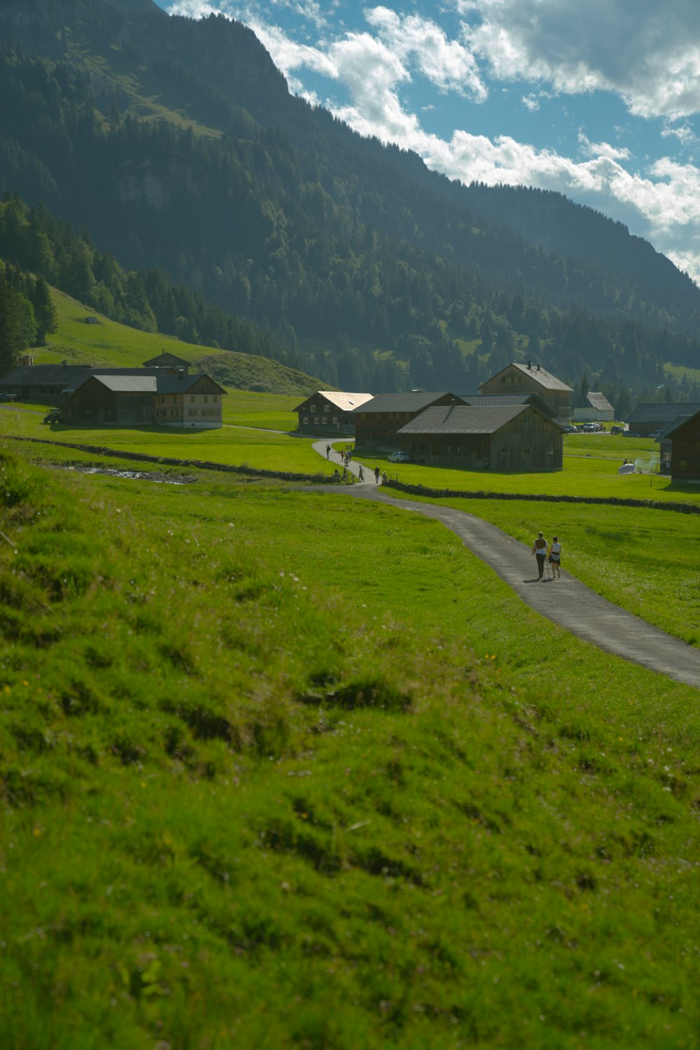 a person riding a bike down a dirt road