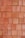 A neatly stacked arrangement of uniform red bricks arranged in a tight pattern covering the entire frame. The bricks vary slightly in hue and texture, giving the arrangement a somewhat rustic and natural appearance.