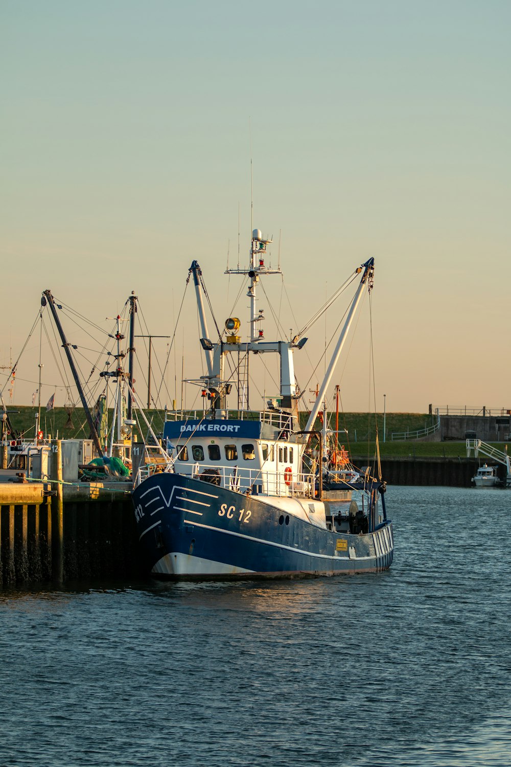 a blue and white boat in a body of water