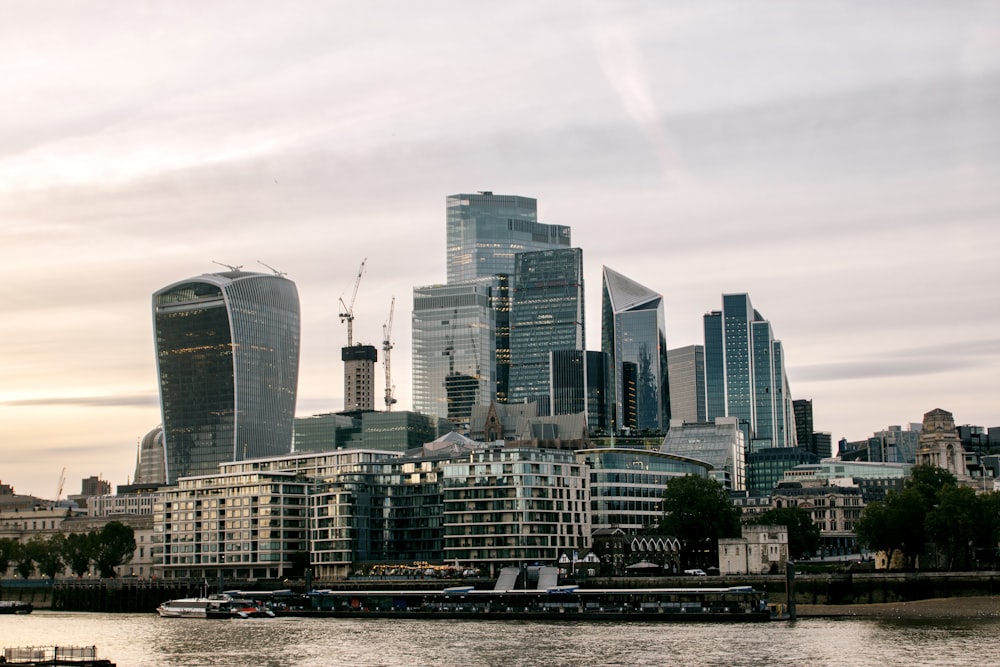 a city skyline with a boat in the foreground