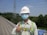 A satisfied customer giving a thumbs up in front of a completed construction project.