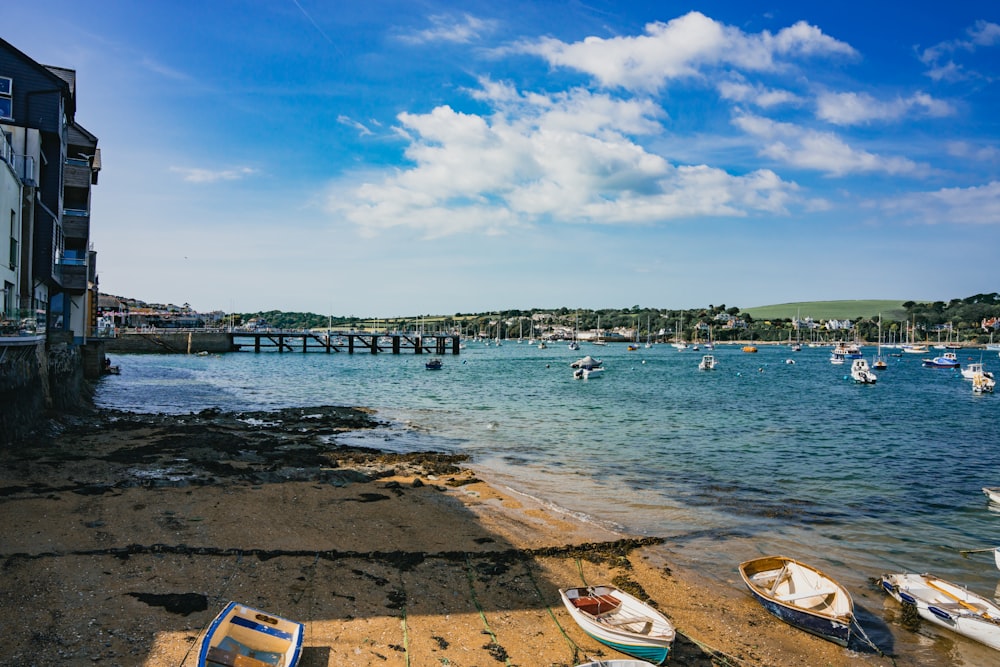 a group of boats sitting on top of a beach