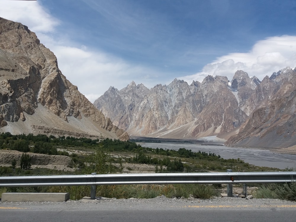 a view of a mountain range from a highway