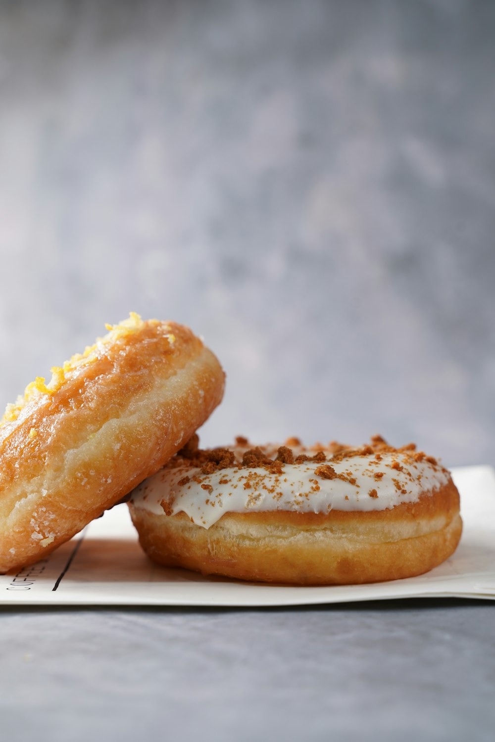 a couple of doughnuts sitting on top of a napkin