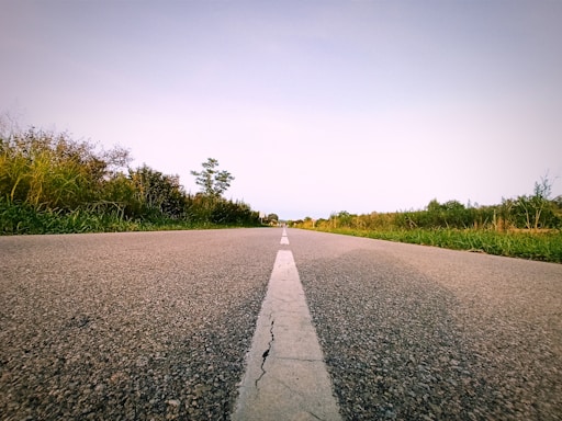 a road with a white line on the side of it