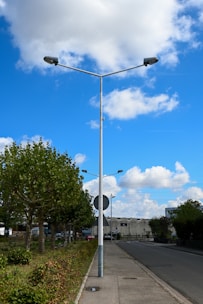 a street light sitting on the side of a road