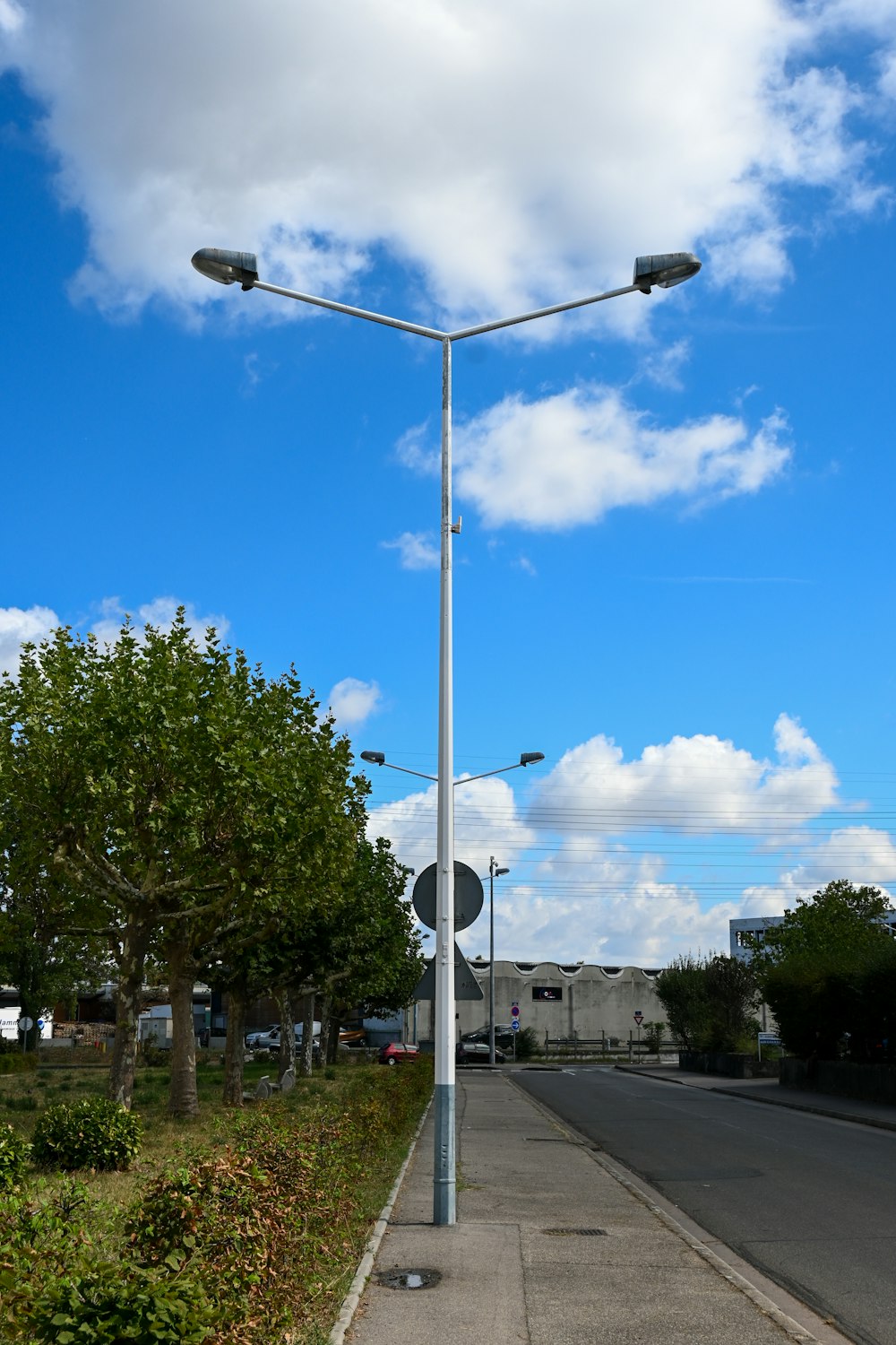a street light sitting on the side of a road