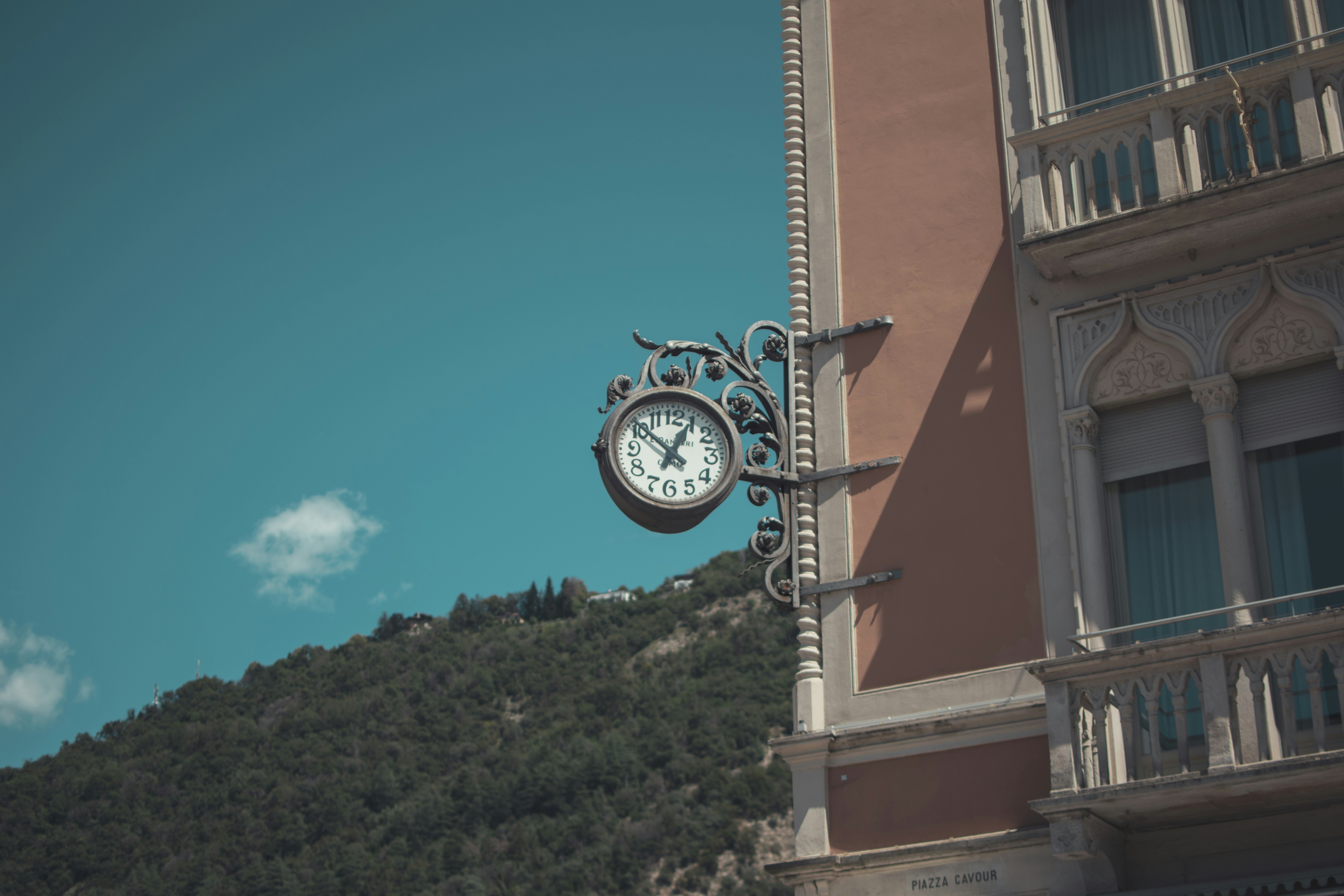 a clock on the side of a building, Looking up in Como